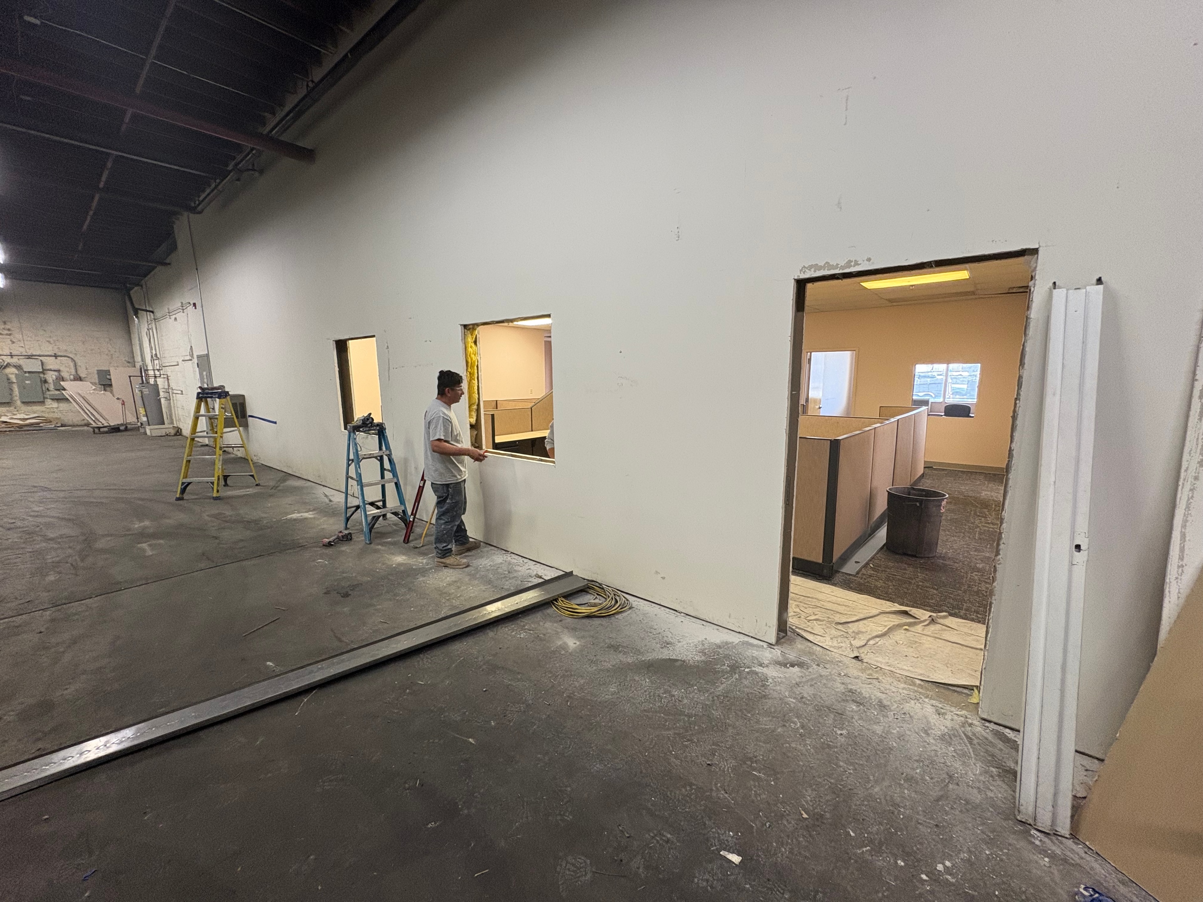 Armorpoxy interior fit-out construction progress with framed office partitions