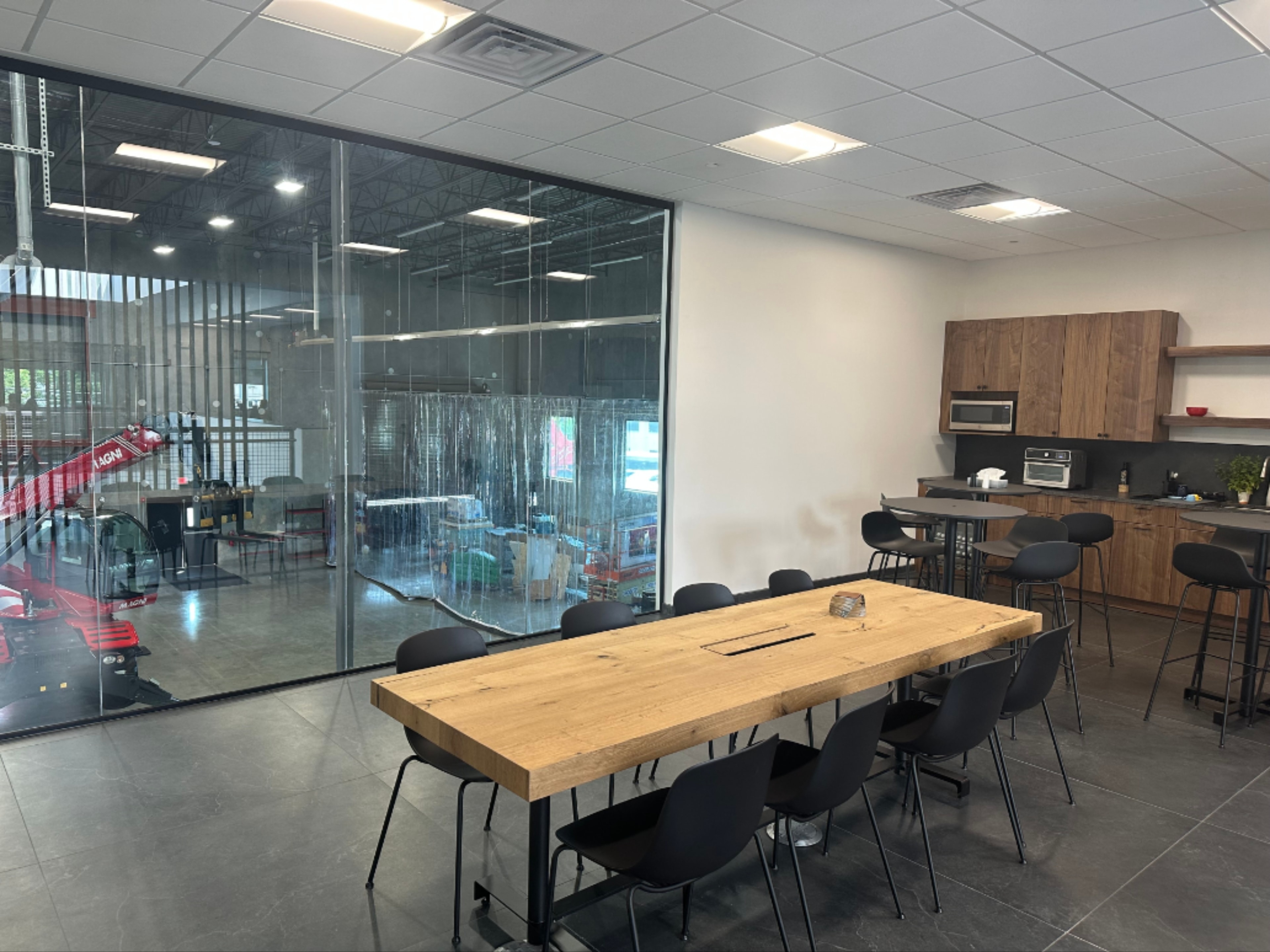 Magni America conference room overlooking warehouse floor